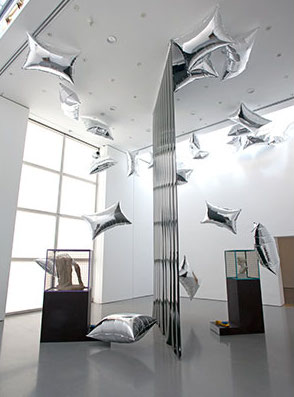 Installation view of Indifferent Matter; Steven Claydon, A Setting for Ambivalent Objects, 2013, Courtesy the artist and Sadie Coles HQ, London, and The British Museum; Andy Warhol, Silver Clouds, 1966, The Andy Warhol Museum in cooperation with The Andy Warhol Foundation for the Visual Arts, Inc. and Billy Klüver © The Andy Warhol Foundatio. Photo: Jerry Hardman-Jones, Courtesy of the Henry Moore Institute